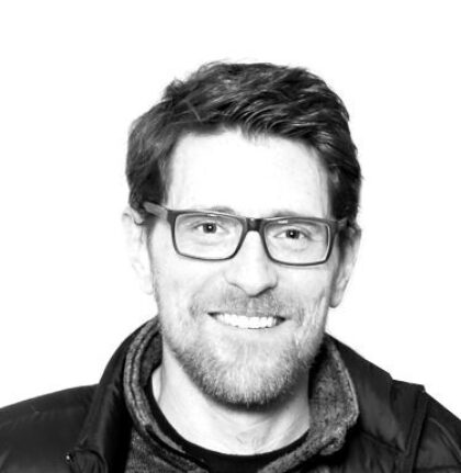 A black and white photo of a very typical looking web designer/developer